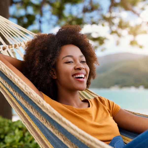 Woman using laundry service near me while relaxing in a hammock